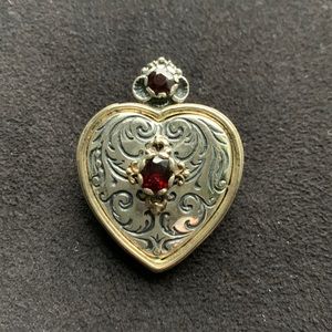Vintage silver pendant with garnet stones.